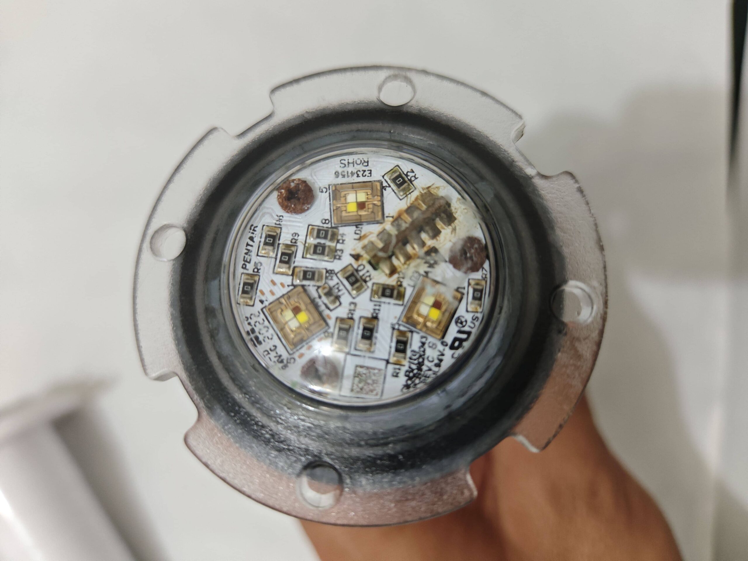 Failed Pentair GloBrite pool light with severe internal rust and water intrusion